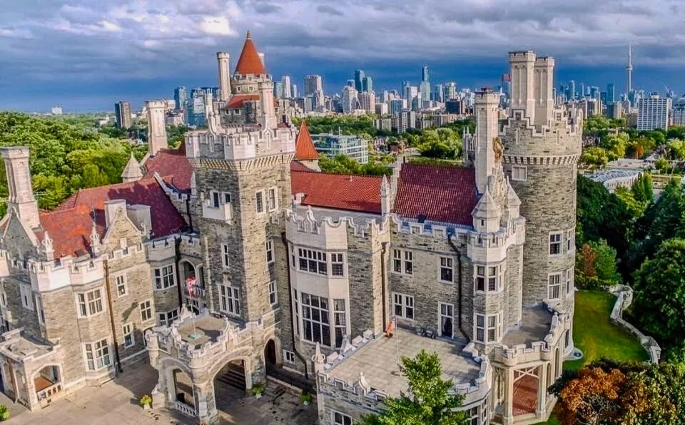Pre-wedding shoot at Casa Loma in Toronto, featuring the castle's dramatic turrets, stone walls, and formal gardens.