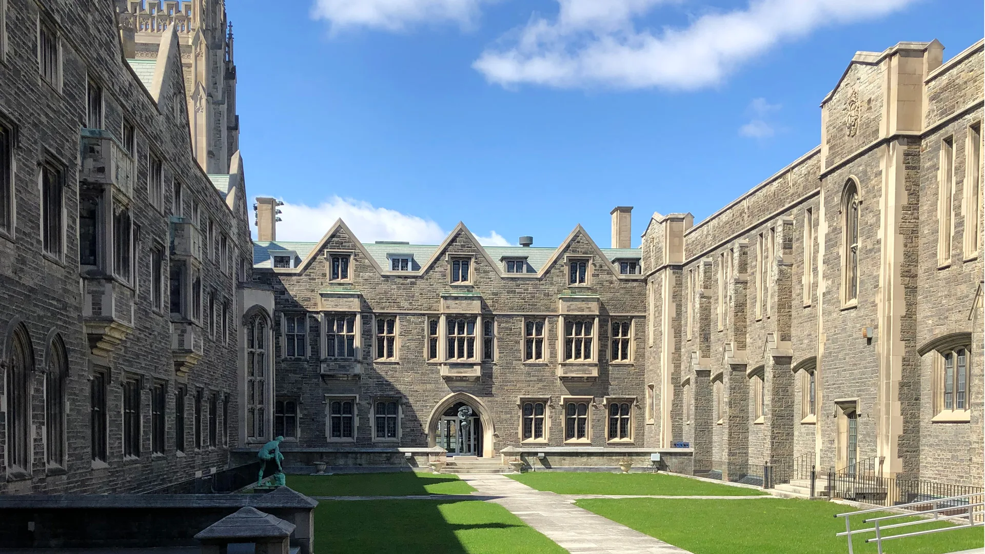 Historic stone architecture and landscaped courtyards at Hart House, University of Toronto, for an engagement session.