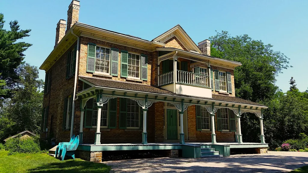 Georgian-style historic home with green shutters at Benares Historic House.