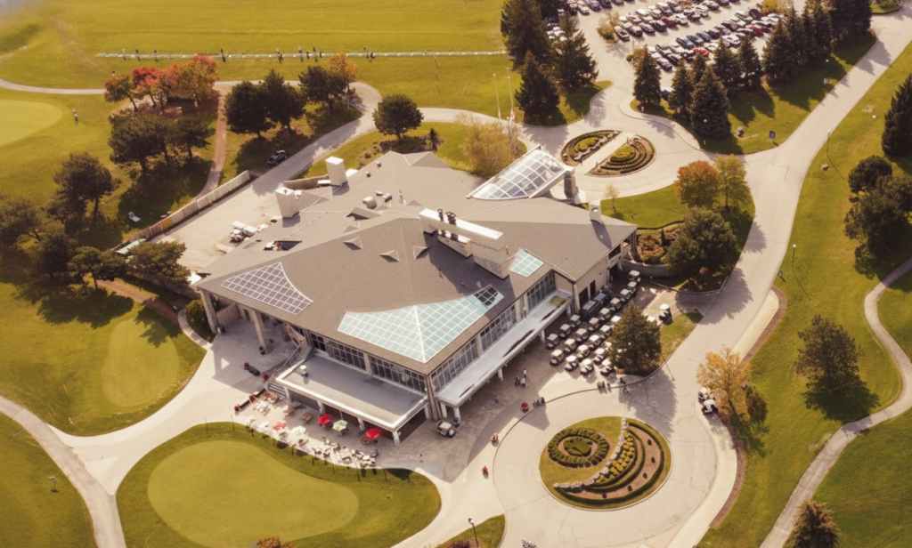 Historic Tudor-style clubhouse exterior at Lionhead Golf Club Brampton surrounded by trees.