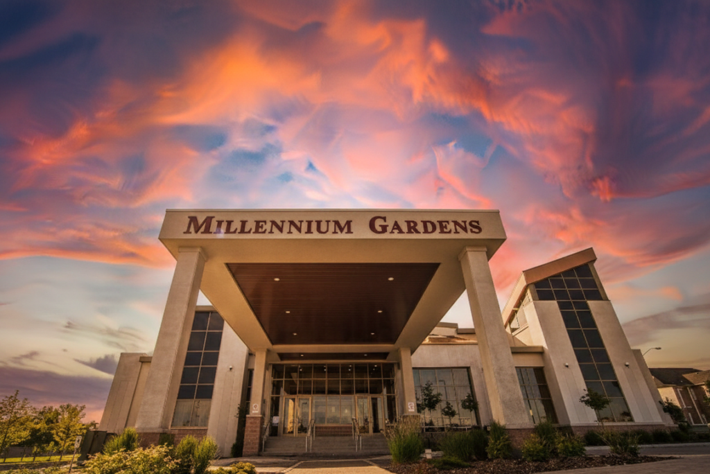 Modern exterior of Millennium Gardens Banquet Centre with glass accents.