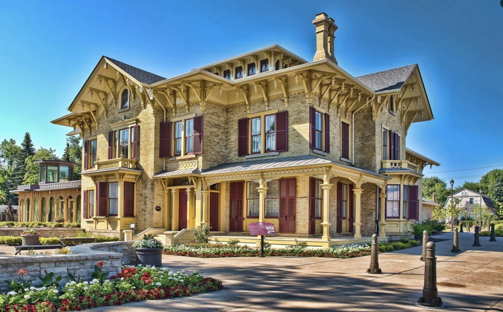 Historic 19th-century Italianate mansion exterior of The Alderlea in downtown Brampton with manicured gardens.